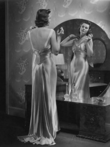 george-marks-woman-wearing-dress-looking-in-mirror